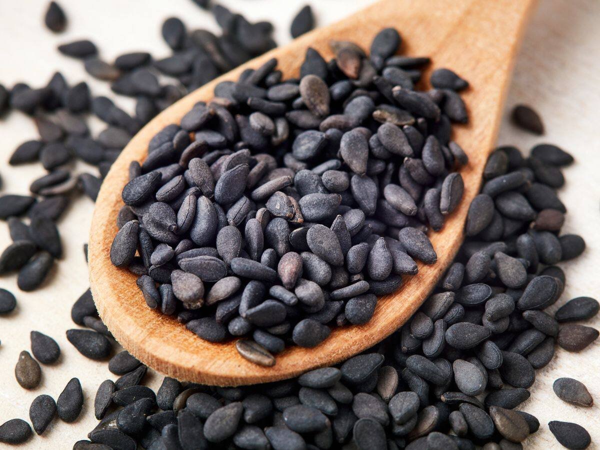 Heap of shiny, jet-black Sesame Seeds (Kala Tal) ready for packing at Jalaram Food Products.